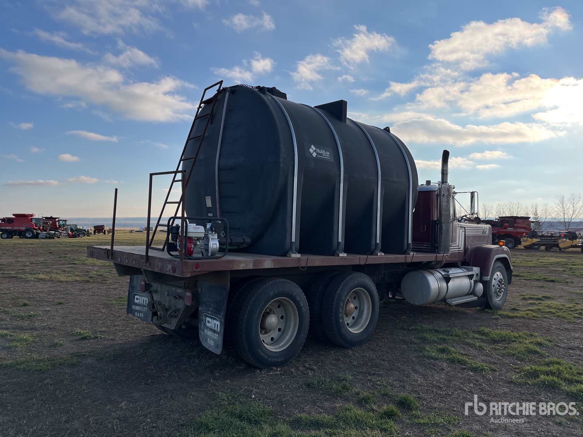 1985 Mack RW613 15140 L 6x4 Flatbed Water Truck | Ritchie Bros. Auctioneers