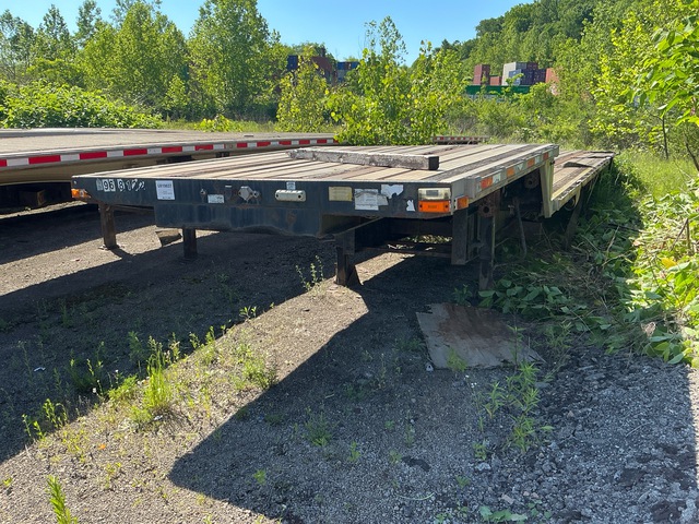 2009 Transcraft DTL-2100W2 48 ft T/A Spread Axle Step Deck Trailer