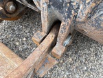 Chassis with Clavijas del cangilón al brazo elevador