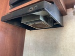 Interior with Stove Hood Exhaust Fan and Vent Cover